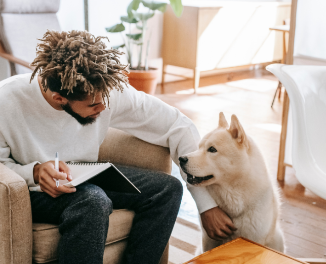 man-with-dog-at-home